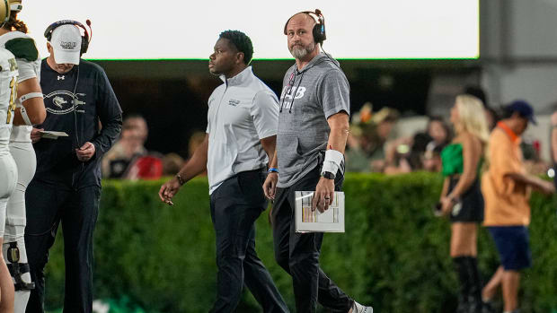 UAB coach Trent Dilfer on the field during the game against Georgia at Sanford Stadium.